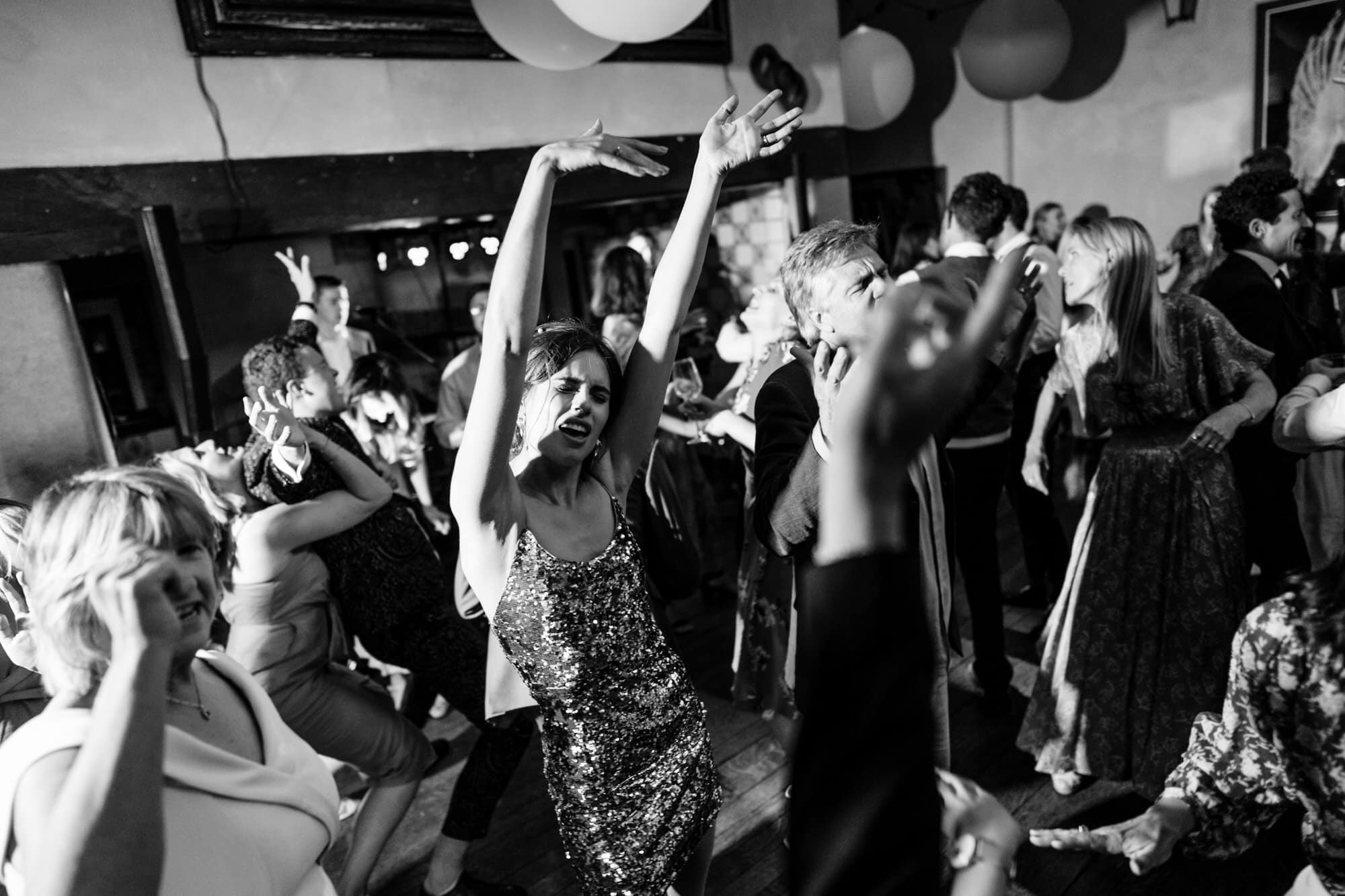 Voewood wedding photography - people dancing at a party